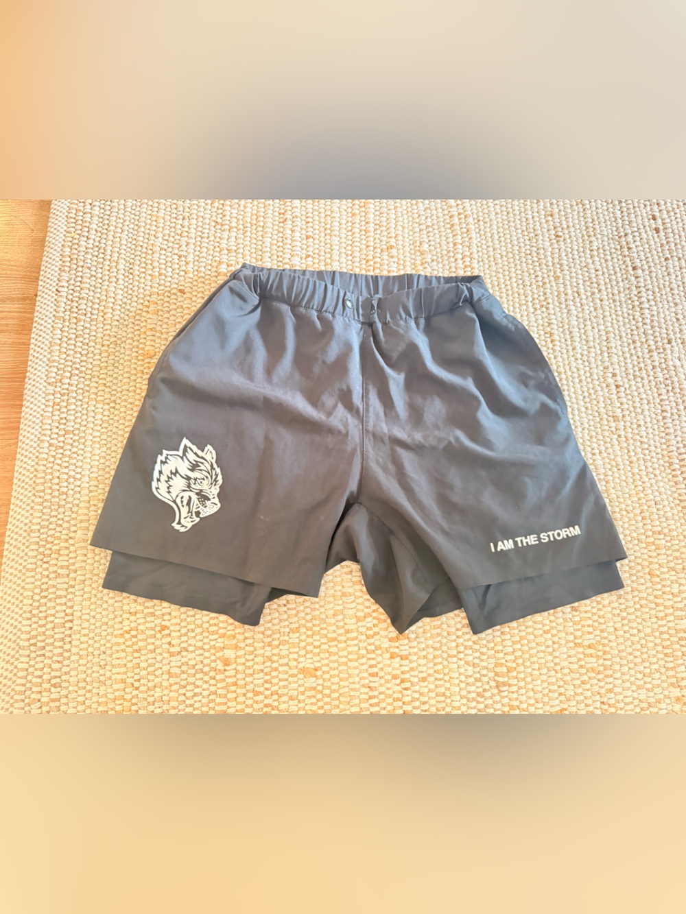 Black Athletic Shorts with Wolf Logo and "I AM THE STORM" Print